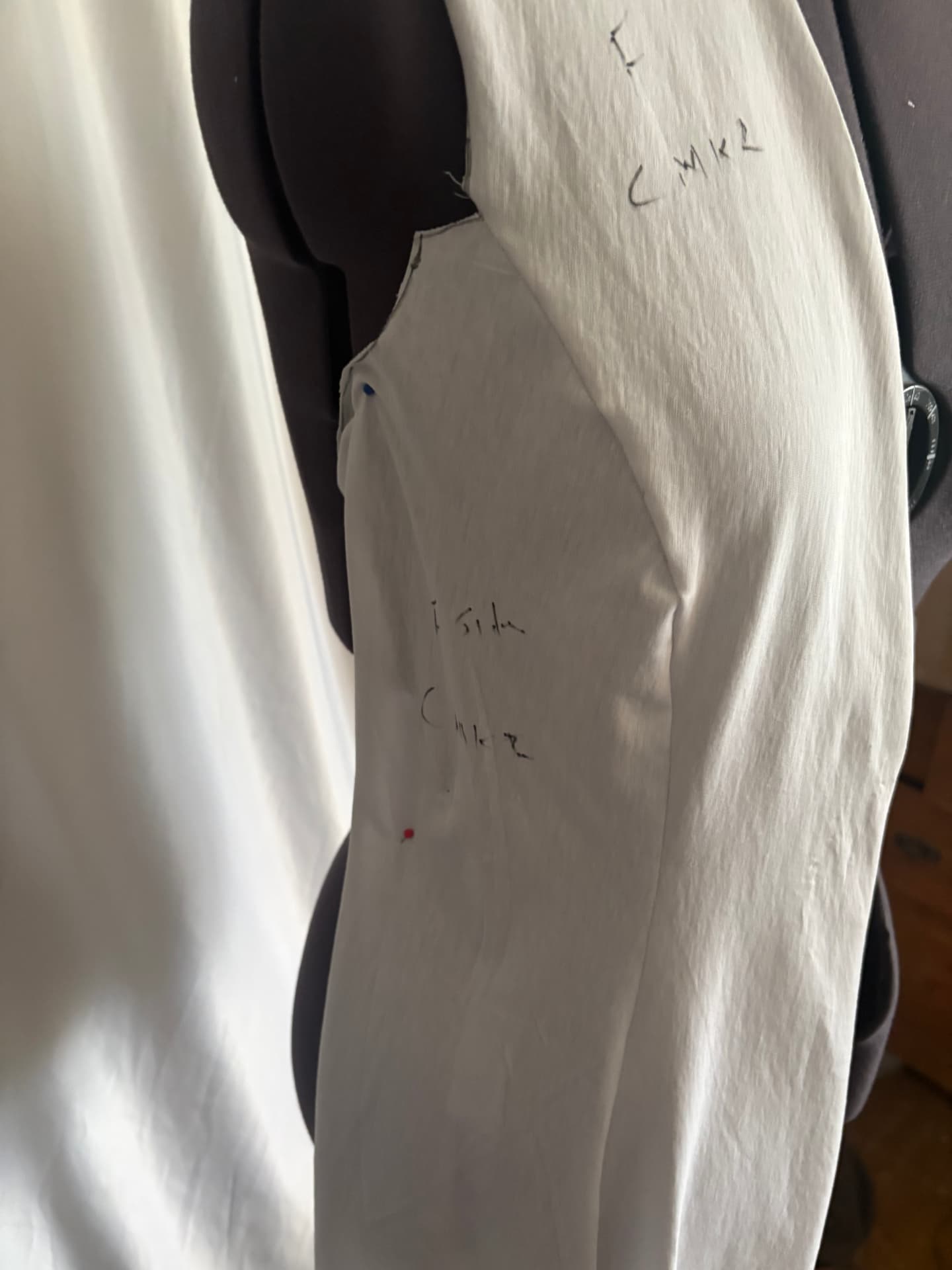 Pinned, altered, tried again. The shape begins to find its way.
