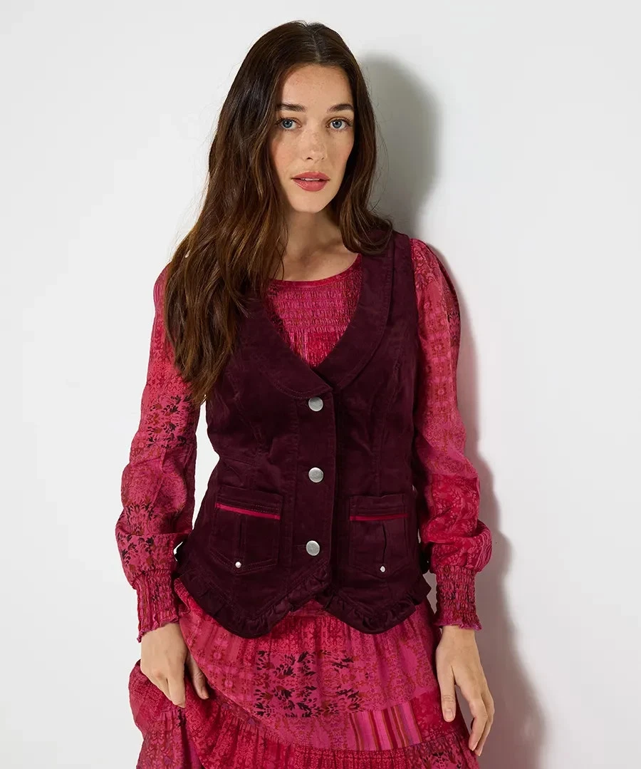Close view of the Freya waistcoat worn over a pink blouse